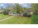 Single story home with palm tree and walkway at 89 Hickory Hills Cir, Ormond Beach, FL 32174