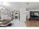 Modern kitchen with white cabinets, marble floors, and dining area at 89 Hickory Hills Cir, Ormond Beach, FL 32174