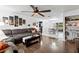 Open living area with gray sectional sofa and view into the dining area at 89 Hickory Hills Cir, Ormond Beach, FL 32174