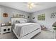 Main bedroom with king-size bed, nightstands, and carpet at 89 Hickory Hills Cir, Ormond Beach, FL 32174