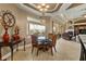 Bright breakfast nook with glass table and seating for four at 1011 Hampstead Ln, Ormond Beach, FL 32174