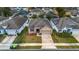 Aerial view of a single-Gathering home with a two-car garage and landscaped yard at 111 Big Pine Key Blvd, Deland, FL 32720