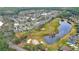 Aerial view showcasing community near golf course at 1453 Sunningdale Ln, Ormond Beach, FL 32174