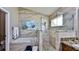 Spa-like bathroom with soaking tub and walk-in shower at 1453 Sunningdale Ln, Ormond Beach, FL 32174