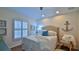 Guest bedroom with a queen-size bed, white shutters, and nautical decor at 1453 Sunningdale Ln, Ormond Beach, FL 32174