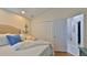 Main bedroom with a queen bed, ample closet space and access to the bathroom at 1453 Sunningdale Ln, Ormond Beach, FL 32174