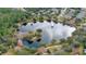 Community lake with fountain and walking paths at 1453 Sunningdale Ln, Ormond Beach, FL 32174