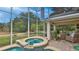Enclosed hot tub with adjacent seating area at 1453 Sunningdale Ln, Ormond Beach, FL 32174