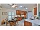 Kitchen with wood cabinets, stainless steel appliances, and a breakfast nook at 1453 Sunningdale Ln, Ormond Beach, FL 32174