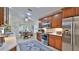 Open concept kitchen with stainless steel appliances and breakfast nook at 1453 Sunningdale Ln, Ormond Beach, FL 32174