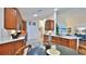 Modern kitchen featuring wood cabinets and granite countertops at 1453 Sunningdale Ln, Ormond Beach, FL 32174