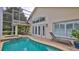 Lush landscaping surrounds this beautiful pool and patio area at 1453 Sunningdale Ln, Ormond Beach, FL 32174