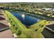 Aerial view of pond and community homes at 1510 Kinnard Cir, Ormond Beach, FL 32174