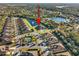 Aerial view of house showcasing its location in a community with a pond at 1510 Kinnard Cir, Ormond Beach, FL 32174