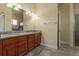 Bathroom with double vanity, granite countertop, and shower at 1510 Kinnard Cir, Ormond Beach, FL 32174
