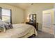 Bedroom with dresser and yellow bedding at 1510 Kinnard Cir, Ormond Beach, FL 32174