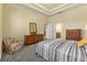 Bedroom with dresser, chair, and striped bedding at 1510 Kinnard Cir, Ormond Beach, FL 32174