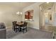Dining room features a wooden table and kitchen passthrough at 1510 Kinnard Cir, Ormond Beach, FL 32174