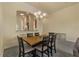 Spacious dining room with wooden table and kitchen access at 1510 Kinnard Cir, Ormond Beach, FL 32174