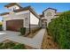 Two-story house with walkway, landscaping, and brown garage door at 1510 Kinnard Cir, Ormond Beach, FL 32174