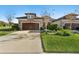 Two-car garage home with a landscaped yard and driveway at 1510 Kinnard Cir, Ormond Beach, FL 32174