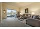 Relaxing living room featuring a sofa and access to patio at 1510 Kinnard Cir, Ormond Beach, FL 32174
