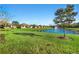 Community pond with fountain and lush landscaping at 1510 Kinnard Cir, Ormond Beach, FL 32174