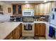 Well-equipped kitchen with light wood cabinets and appliances at 2750 Ocean Shore Blvd # 4, Ormond Beach, FL 32176