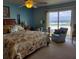 Main bedroom with ocean view and king-size bed at 2750 Ocean Shore Blvd # 4, Ormond Beach, FL 32176