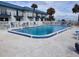 Inviting community pool with surrounding lounge chairs at 2750 Ocean Shore Blvd # 4, Ormond Beach, FL 32176