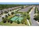 Aerial view of community with homes, roads, and pickleball courts at 3238 Bailey Ann Dr, Ormond Beach, FL 32174