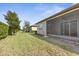 Landscaped backyard with lush lawn and hedge at 3238 Bailey Ann Dr, Ormond Beach, FL 32174