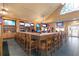 Large bar with seating and multiple TV screens at 3238 Bailey Ann Dr, Ormond Beach, FL 32174