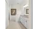 Clean bathroom with white cabinets, granite countertops, and a double vanity at 3238 Bailey Ann Dr, Ormond Beach, FL 32174