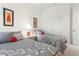 Spacious bedroom with two twin beds, grey bedding, and neutral decor at 3238 Bailey Ann Dr, Ormond Beach, FL 32174