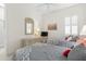 Well-lit bedroom with twin beds, dresser, and a flat-screen TV at 3238 Bailey Ann Dr, Ormond Beach, FL 32174