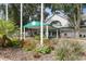 Attractive clubhouse entrance with flowerbeds at 3238 Bailey Ann Dr, Ormond Beach, FL 32174