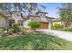 Two-story house with a brown door and manicured lawn at 3238 Bailey Ann Dr, Ormond Beach, FL 32174