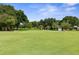 Putting green with trees and blue sky at 3238 Bailey Ann Dr, Ormond Beach, FL 32174
