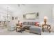 Comfortable living room with sectional sofa, coffee table, and view of kitchen at 3238 Bailey Ann Dr, Ormond Beach, FL 32174