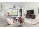 Living room with sectional sofa, coffee table, and access to backyard at 3238 Bailey Ann Dr, Ormond Beach, FL 32174