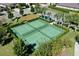 Aerial view of well-maintained pickleball courts in a residential community at 3238 Bailey Ann Dr, Ormond Beach, FL 32174