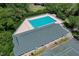 Community lap pool with lounge chairs and adjacent building at 3238 Bailey Ann Dr, Ormond Beach, FL 32174