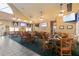 Casual restaurant with multiple tables and TVs at 3238 Bailey Ann Dr, Ormond Beach, FL 32174