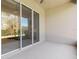 Bright screened porch with sliding glass doors leading to backyard at 3238 Bailey Ann Dr, Ormond Beach, FL 32174