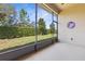 Relaxing screened porch with view of lush backyard at 3238 Bailey Ann Dr, Ormond Beach, FL 32174