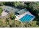 Two tennis courts and community pool viewed from above at 3238 Bailey Ann Dr, Ormond Beach, FL 32174