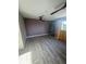 Bright bedroom featuring wood-look floors and ceiling fan at 5500 Ocean Shore Blvd # Ut61, Ormond Beach, FL 32176