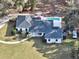 Aerial view of a home featuring a private pool, large backyard, and circular driveway at 7024 Sw 93Rd Street Rd, Ocala, FL 34476