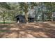Spacious barn providing ample storage and workspace on a property surrounded by beautiful natural surroundings at 7024 Sw 93Rd Street Rd, Ocala, FL 34476